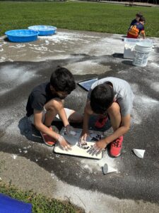 2 children in science activity